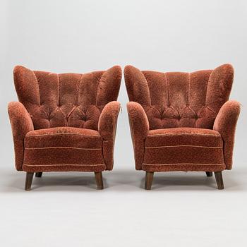 A pair of mid 20th Century armchairs.