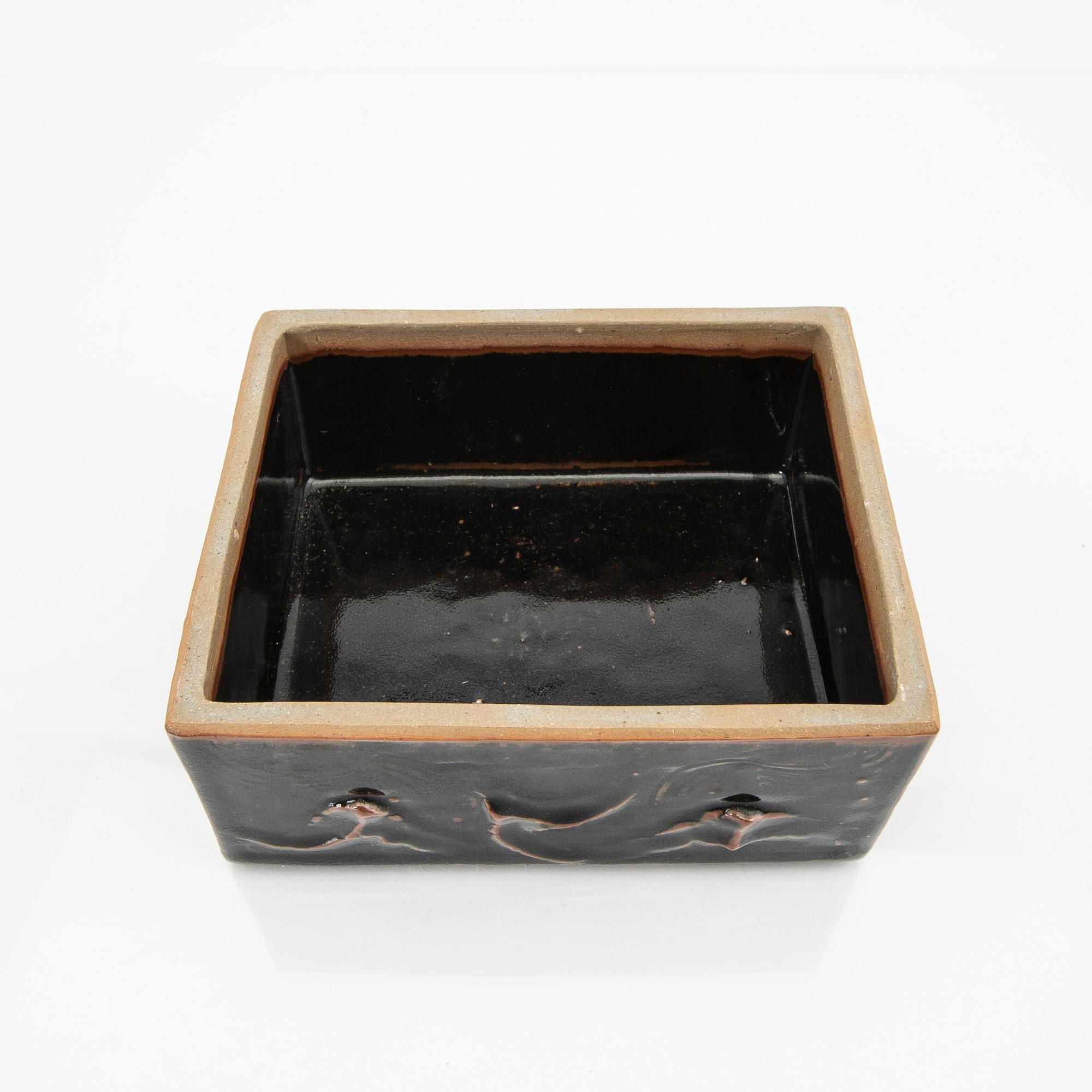 A glazed stone ware box.