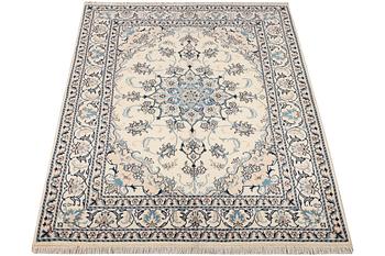 A Nain part silk rug, c. 193 x 148 cm.
