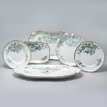 A earthenware table set of 136 pcs "Vexiö Guld",  by Arvid Ekberg, Gustafsberg, from around year 1900.