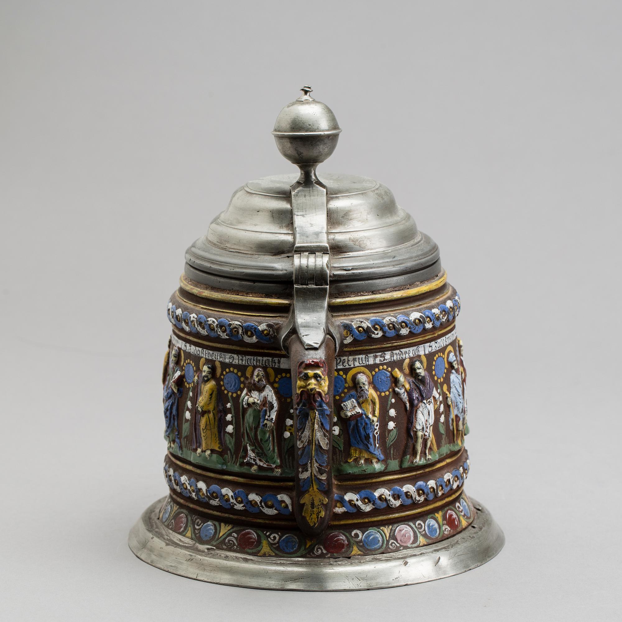 A GERMAN KREUSSEN STONEWARE APOSTLE STEIN TANKARD.