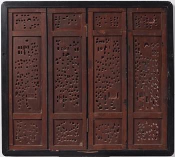 A set of four framed wooden panels, Qing dynasty, 19th Century.