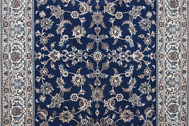 A carpet, Nain, part silk, ca 297 x 194 cm.