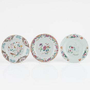 A set of 15 famille rose dinner plates, Qing dynasty, Qianlong and one Canton 19th Century.