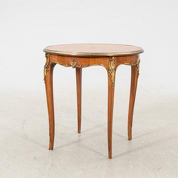 A walnut and mahogany Louis XV-style table first half of the 20th century.