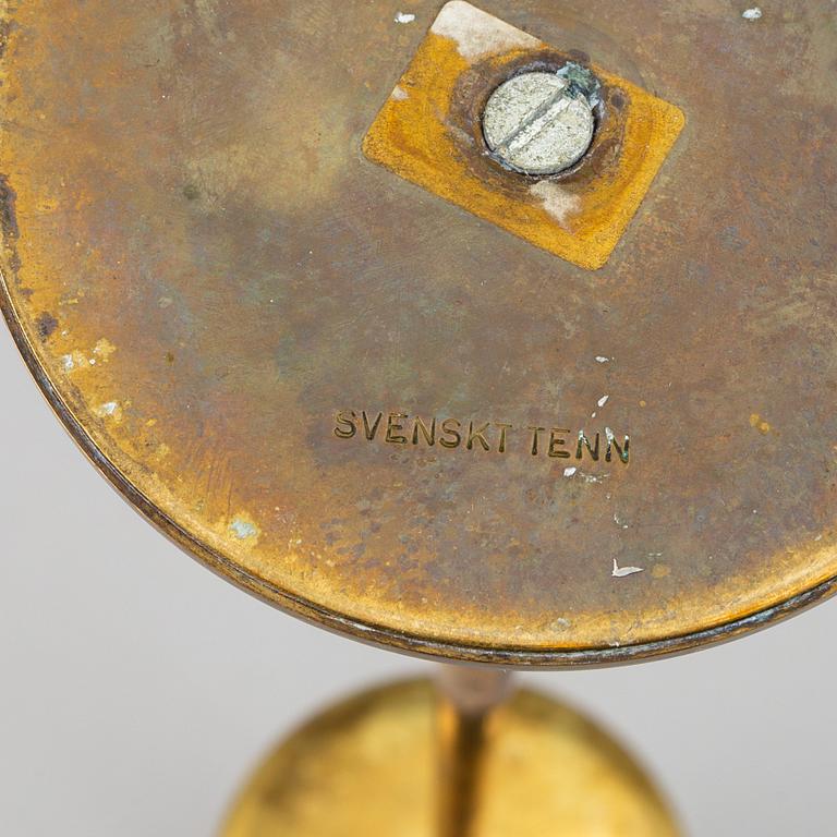A pair of model 2539 brass candlesticks, for Firma Svenskt Tenn, designed ca 1949-50.