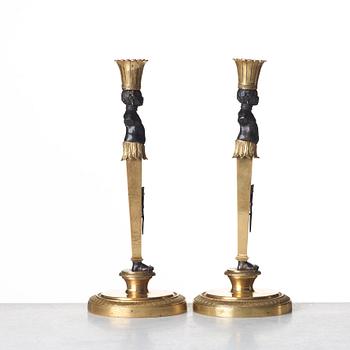 A pair of Empire style candlesticks. Late 19th century.