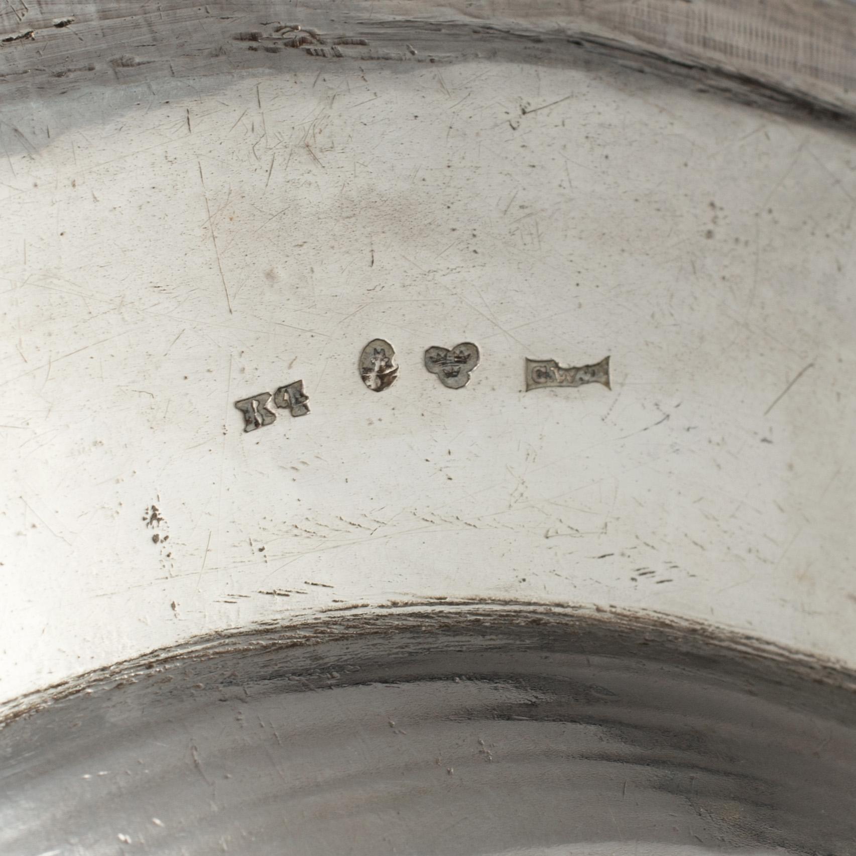 A silver saucepan and a plate, including Adolf Zethelius, Stockholm, 1827.