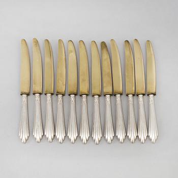 A set of twelve parcel-gilt silver fruite knives from the late 19th century.
