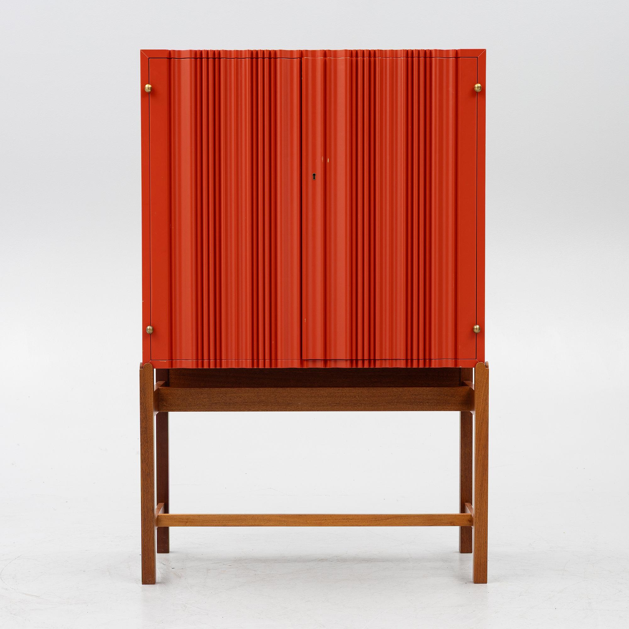 Josef Frank, a red lacquered cabinet, model 2192, 'The Cardboard Cabinet' by Svenskt Tenn, after 1985.