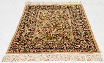 A silk an metal Hereke rug, West Anatolia, c. 100 x 68 cm.