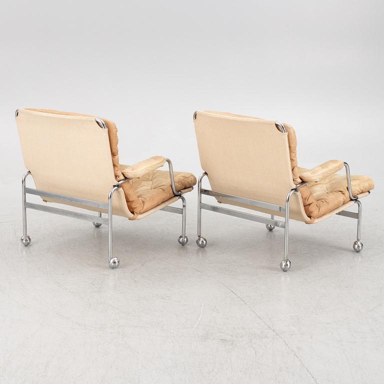 Bruno Mathsson, a pair of "Karin" armchairs, Dux, Sweden, late 20th century.