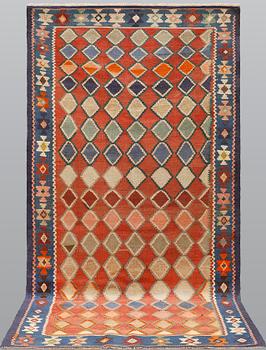 A Persian nomadic Kilim rug, approx. 305 x 155 cm.