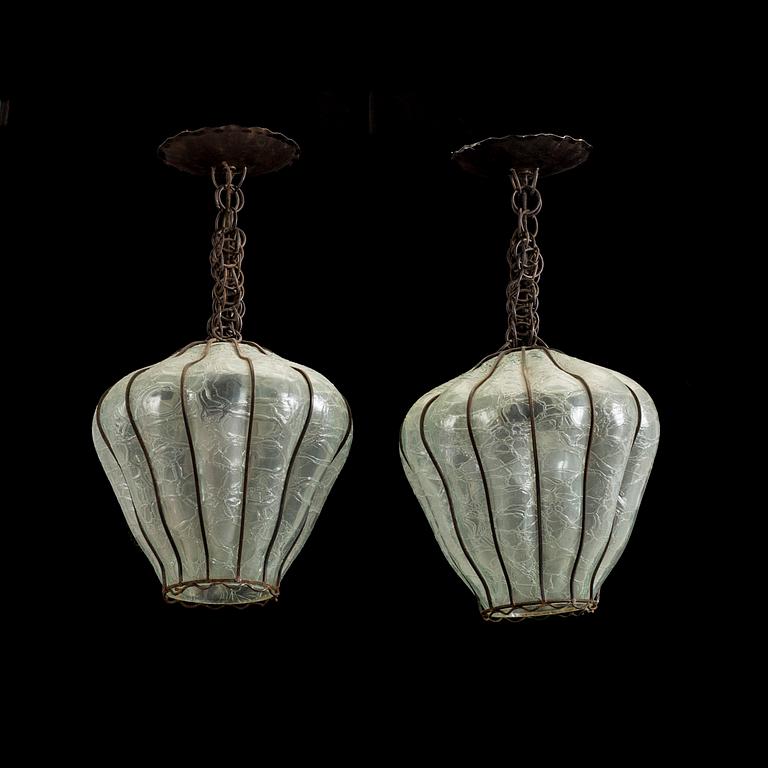 A pair of 20th century glass and metal ceiling lights.