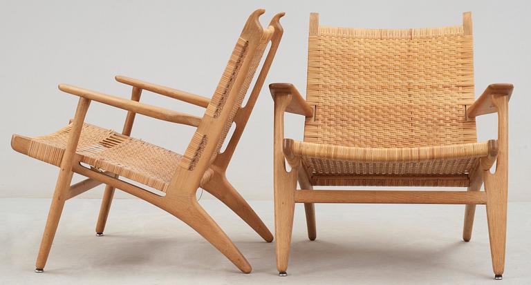 A pair of Hans J Wegner oak and rattan 'CH-27' armchairs, Carl Hansen & Søn, 1950's.