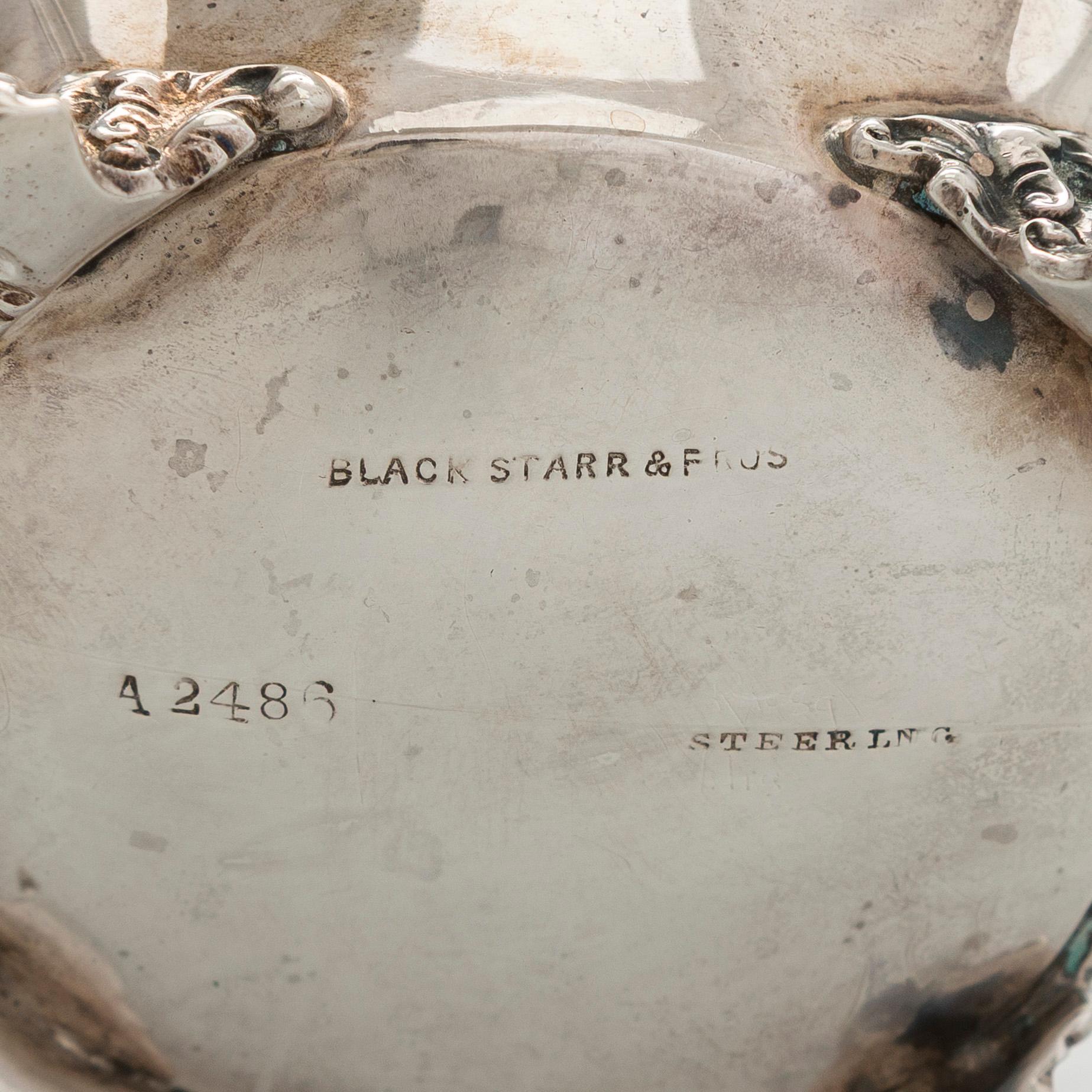 Black Starr & Frost, a pair of sterling silver shakers and sugar bowls, USA around 1900, Gorham pair of sterling spoons.