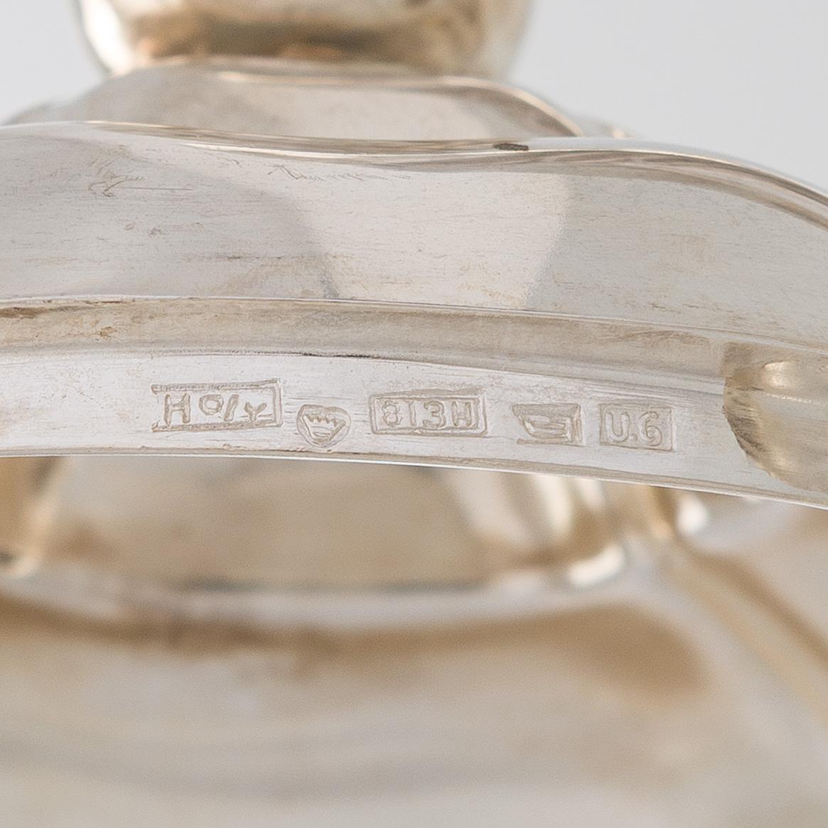 A silver coffee pot, sugar bowl, cream jug, and sugar tongs, Finland 1926-49.