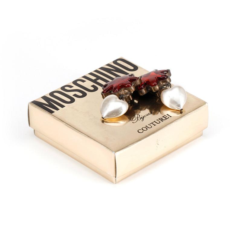 MOSCHINO, a pair of decorative heart shaped pearl clip earrings.