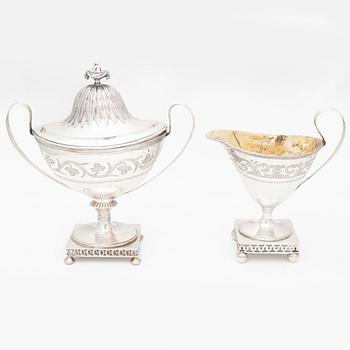 A silver sugarbowl with lid and a creamer, marks of Olof Hellbom, Stockholm, Sweden 1799-1800.