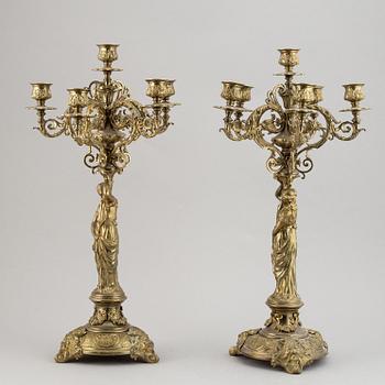 A pair of late 19th century brass candelabra for six candles.
