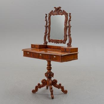 An end of the 19th century Rococo style table with mirror.