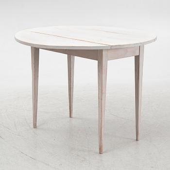 A drop-leaf table, early 20th Century.