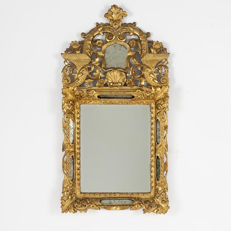 A South German Baroque carved giltwood mirror, early 18th century.