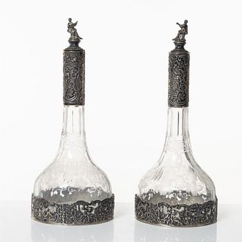 A pair of glass decanters with silver mounts, Swedish import marks, CG Hallberg, early 20th Century.