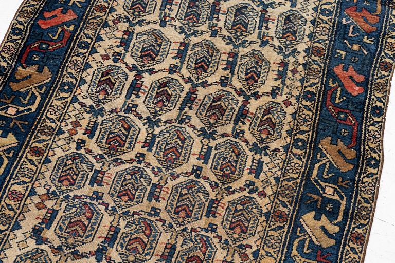 An antique Hamadan rug, c. 188 x 114 cm.