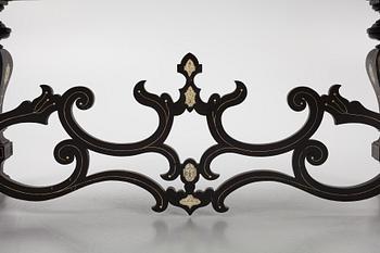 A Renaissance-style ebony, ebonized and ivory-inlaid library table, late 19th century, presumably Germany.