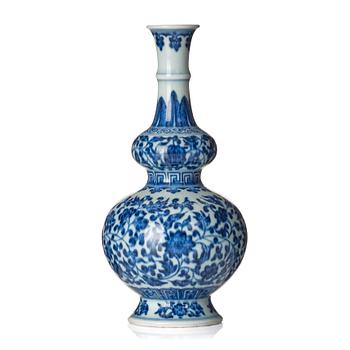 A blue and white gourd shaped lotus vase, presumably Chinese Republic with Qianlong mark.