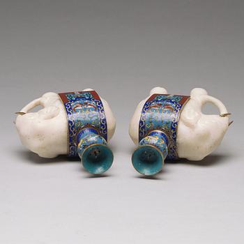 A pair of cloisonné and marble elephant candle holders, late Qing dynasty, about 1900.