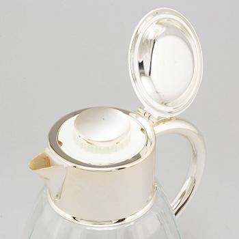 A glass and metal jug, second half of the 20th century, purchased from Firma Svenskt Tenn.