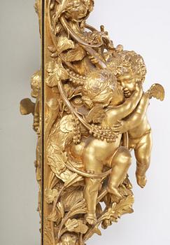 A presumably Dutch Louis XIV carved giltwood frame with mirror glass, in the style of Jean Le Pautre, late 17th century.