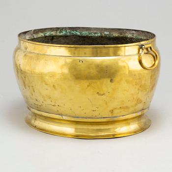 A brass champagne cooler, possibly 17th Century.