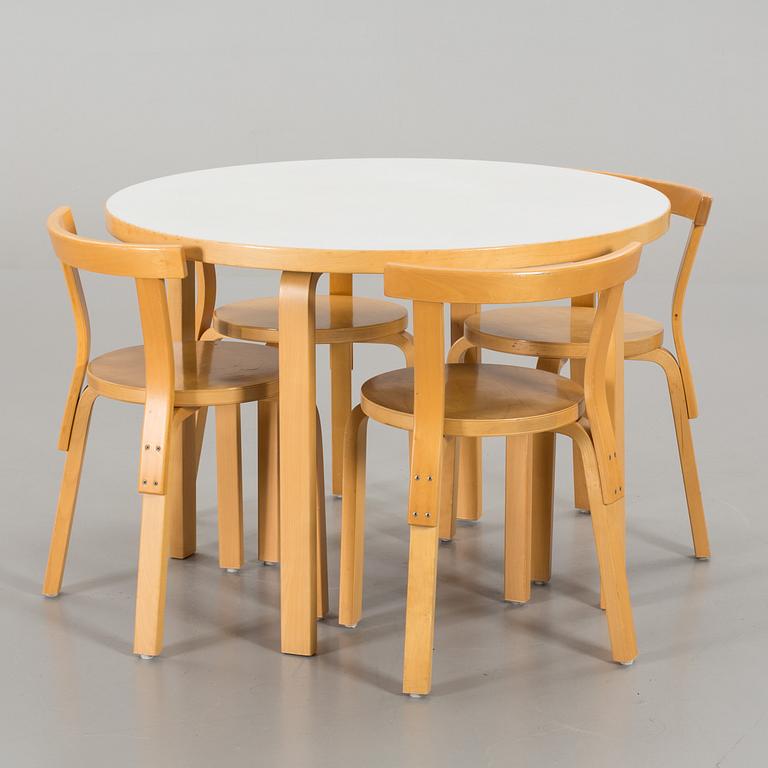 A TABLE AND FOUR CHAIRS DESIGNED BY ALVAR AALTO FOR ARTEK.