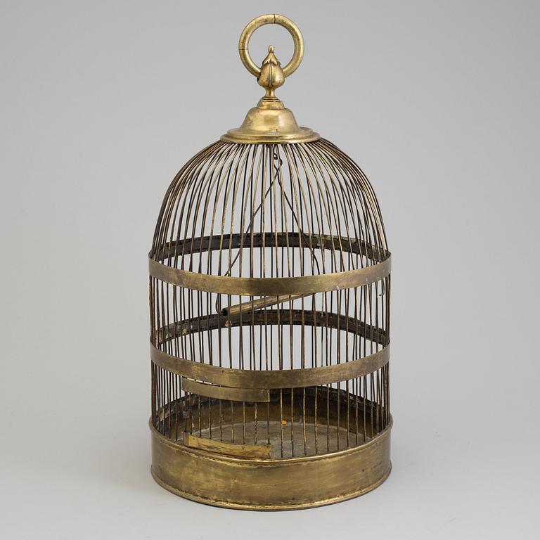 A 19TH CENTURY BRASS BIRD CAGE.