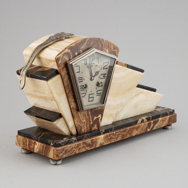 A three piece clock garniture, Art Deco style, 20th Century.