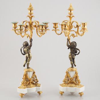 A pair of bronze and marble candelabra, possibly France, late 19th century.