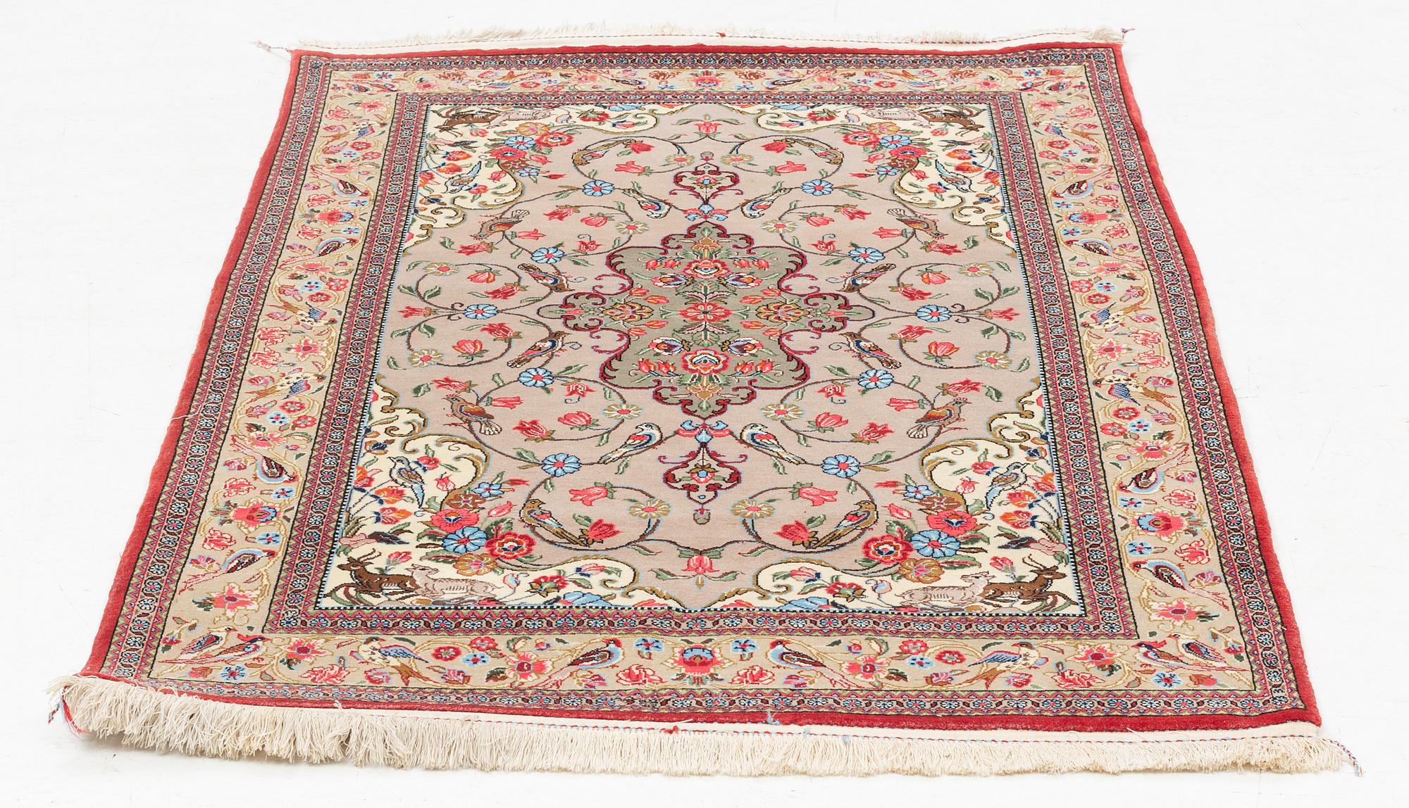 A Ghom rug, c. 160 x 105 cm.