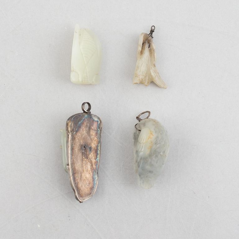 A group of eight Chinese stone charms / pendants, 20th century.