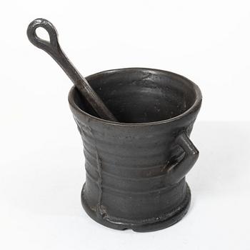 Mortar and pestle, dated 1673.