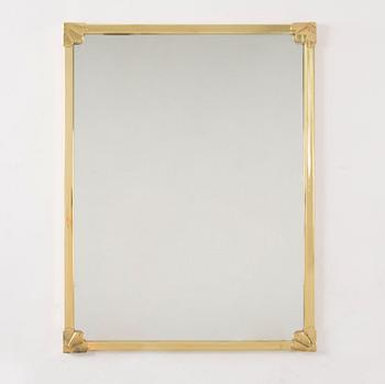 A morror in brass frame, 20th century.