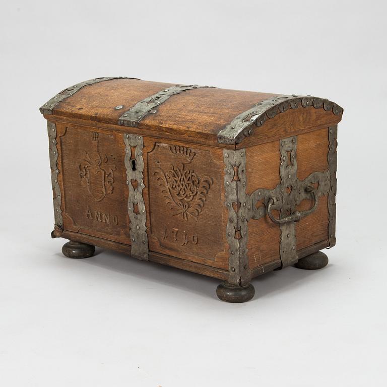 An oak wood chest dated 1710.