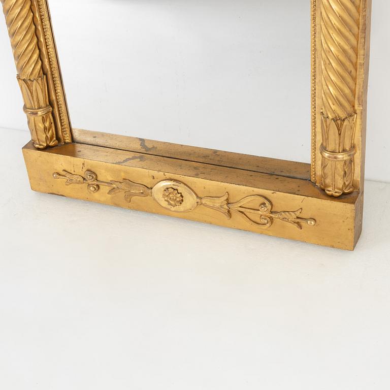 An Empire mirror, first half of the 19th Century.