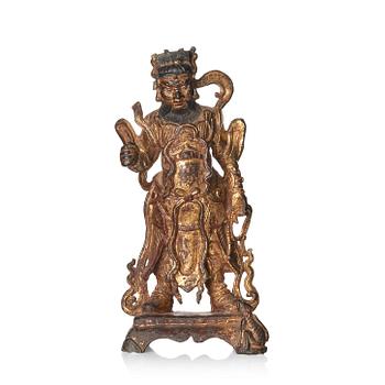 917. A parcel-gilt bronze figure of a guardian, Ming dynasty (1368-1644).