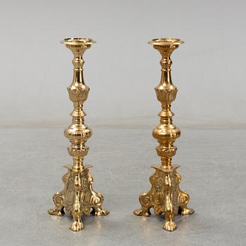A pair of late 20th century or early 21th century brass altar candlesticks.