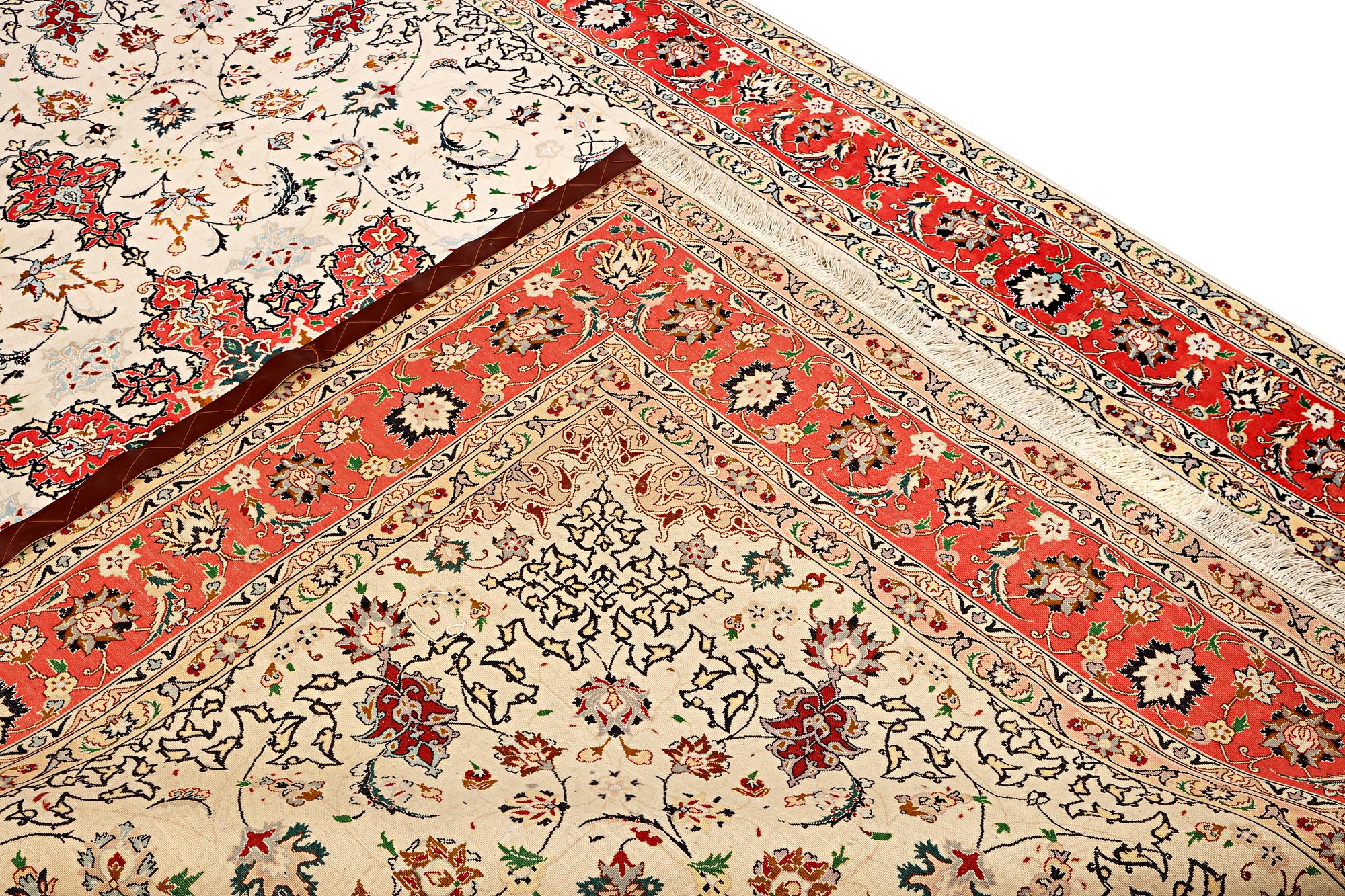 A Tabriz, part silk carpet, c. 300 x 199 cm.