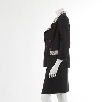 CHANEL, a three-piece suit consisting of jacket, top and skirt.