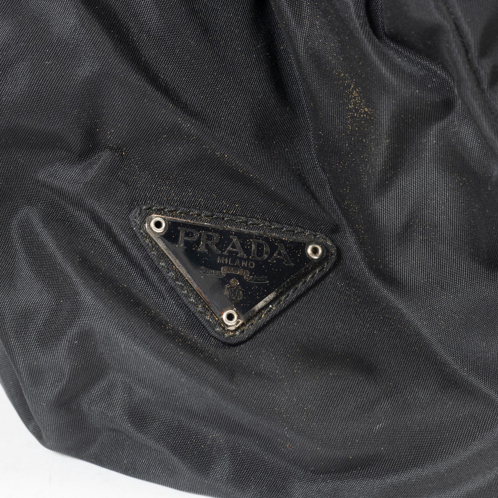 Prada, A nylon and leather backpack.